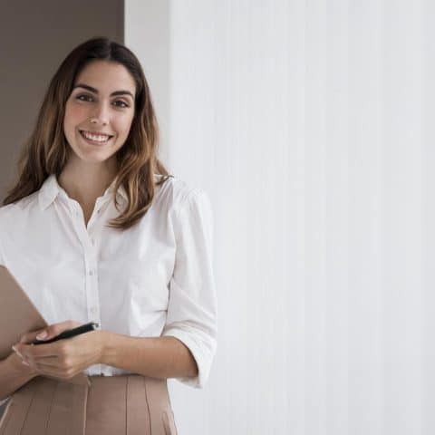 front-view-elegant-businesswoman-holding-clipboard-with-copy-space (1)